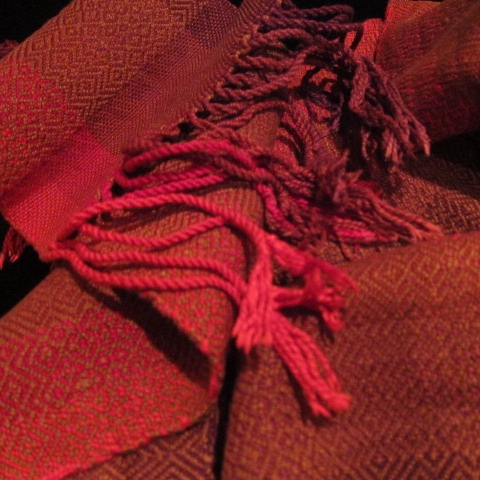 A red, woven table runner.